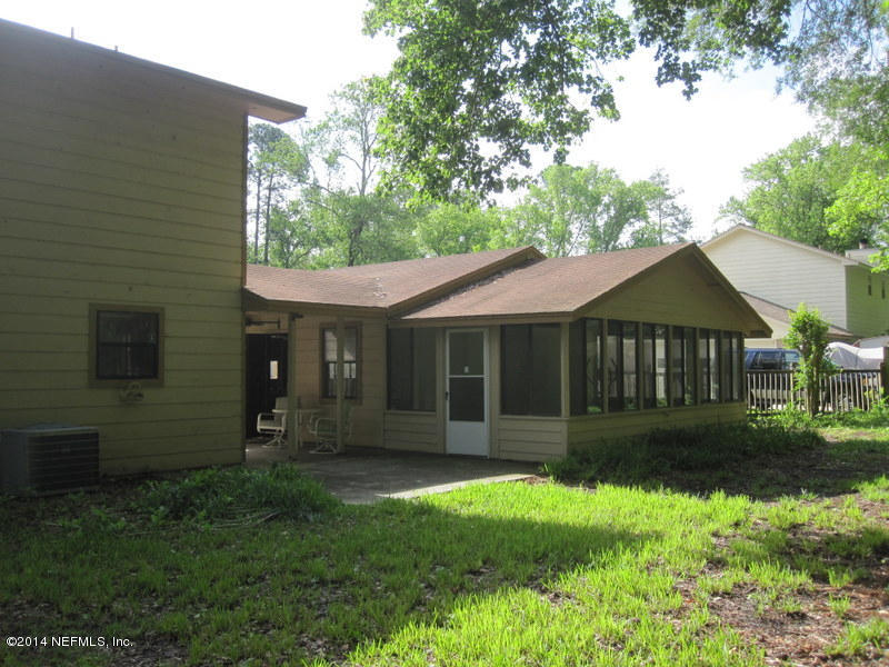 11440 Scott Mill Road Jacksonville, FL 32223 - Photo 26 of 26 a view of a house with a yard