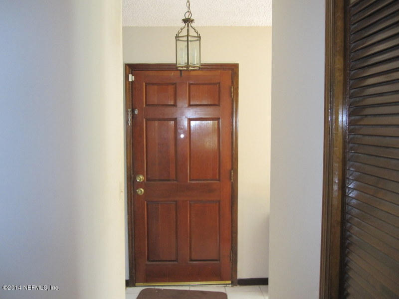 11440 Scott Mill Road Jacksonville, FL 32223 - Photo 4 of 26 a view of a hallway with closet
