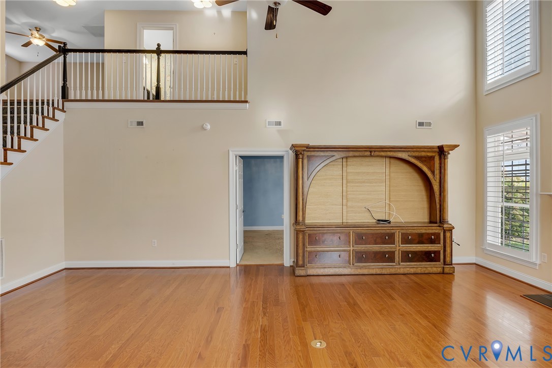 10011 Berry Pond Lane Mechanicsville, VA 23116 - Photo 16 of 47 a view of empty room with wooden floor and fan