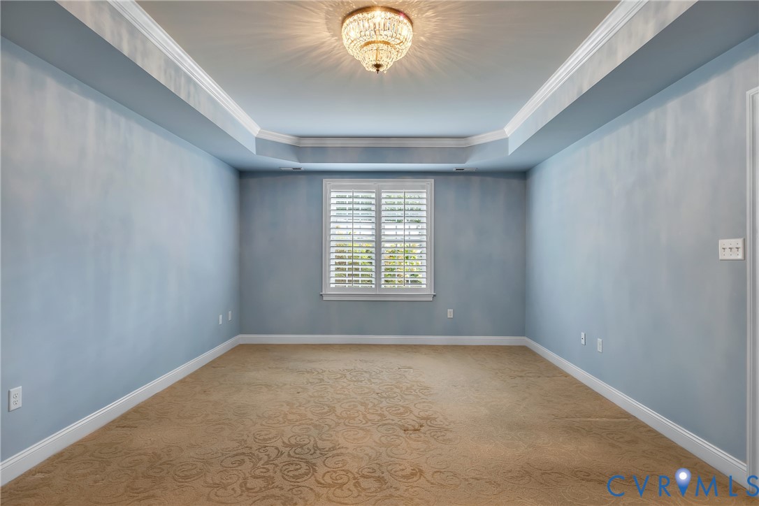 10011 Berry Pond Lane Mechanicsville, VA 23116 - Photo 18 of 47 an empty room with windows and chandelier fan