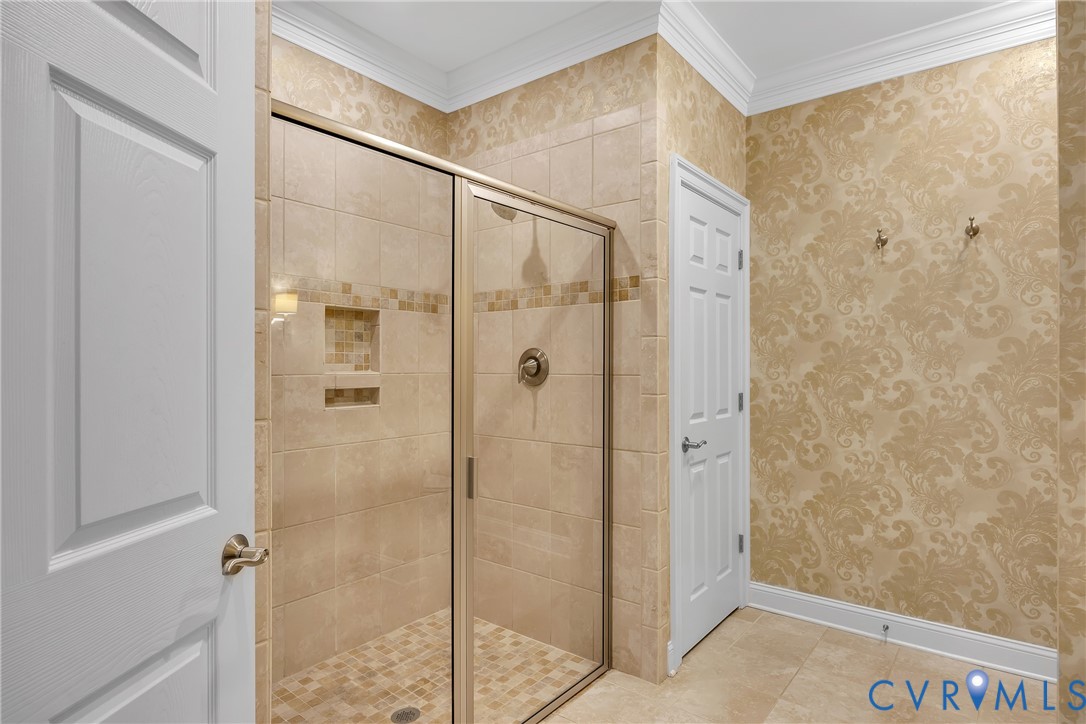 10011 Berry Pond Lane Mechanicsville, VA 23116 - Photo 22 of 47 a bathroom with a glass shower door