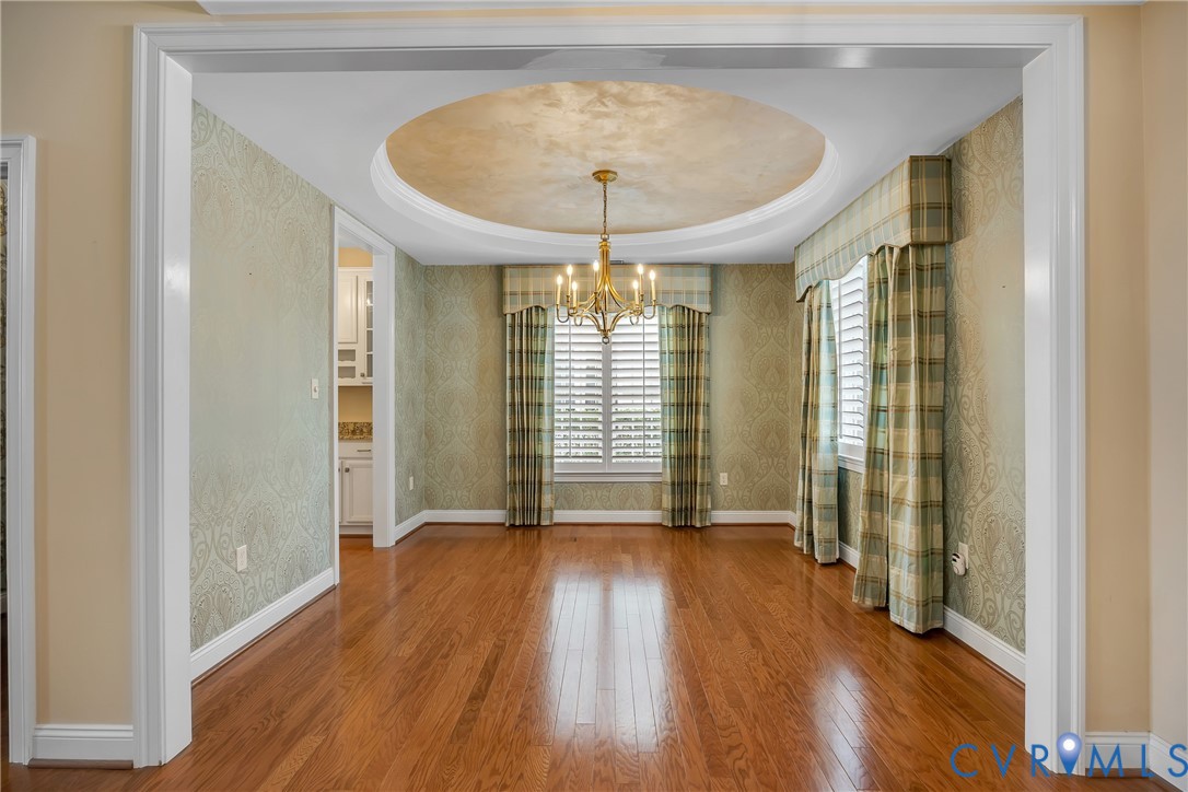 10011 Berry Pond Lane Mechanicsville, VA 23116 - Photo 4 of 47 wooden floor in an empty room with a window