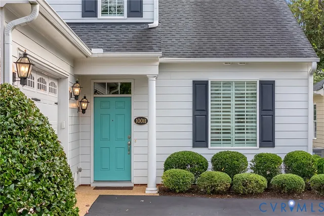 an aerial view of residential house with outdoor space and swimming pool