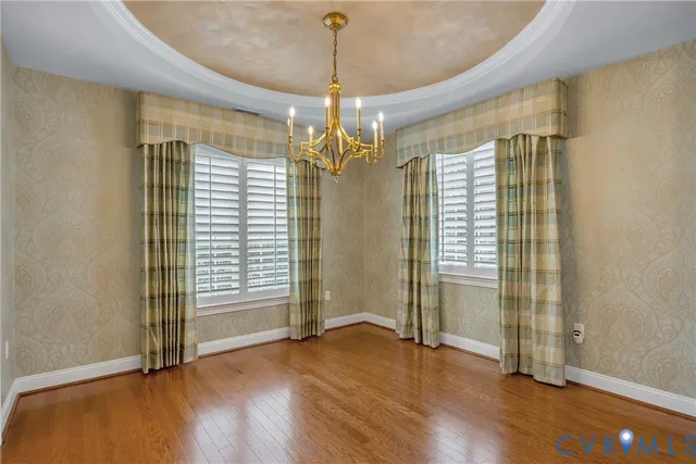 a bathroom with a sink and mirror with toilet