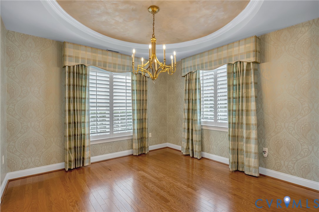 10011 Berry Pond Lane Mechanicsville, VA 23116 - Photo 5 of 47 an empty room with wooden floor and windows