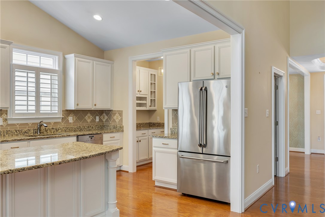 10011 Berry Pond Lane Mechanicsville, VA 23116 - Photo 10 of 47 a kitchen with stainless steel appliances granite countertop a refrigerator sink and cabinets