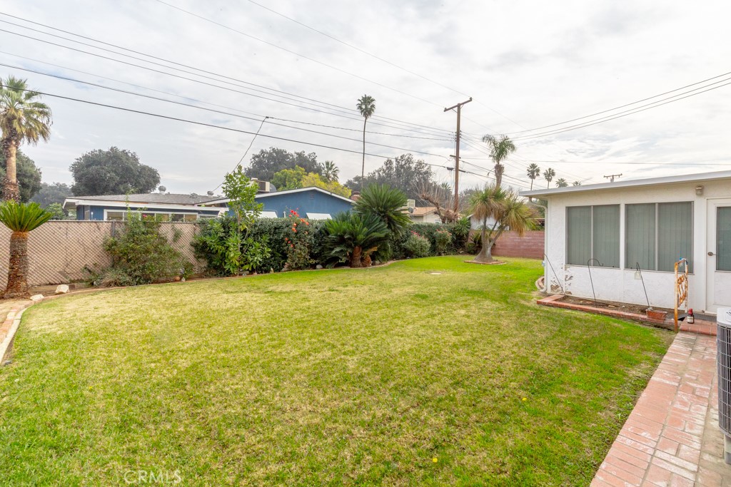 4151 Manchester Place Riverside, CA 92503 - Photo 25 of 36 a view of a house with a yard and potted plants