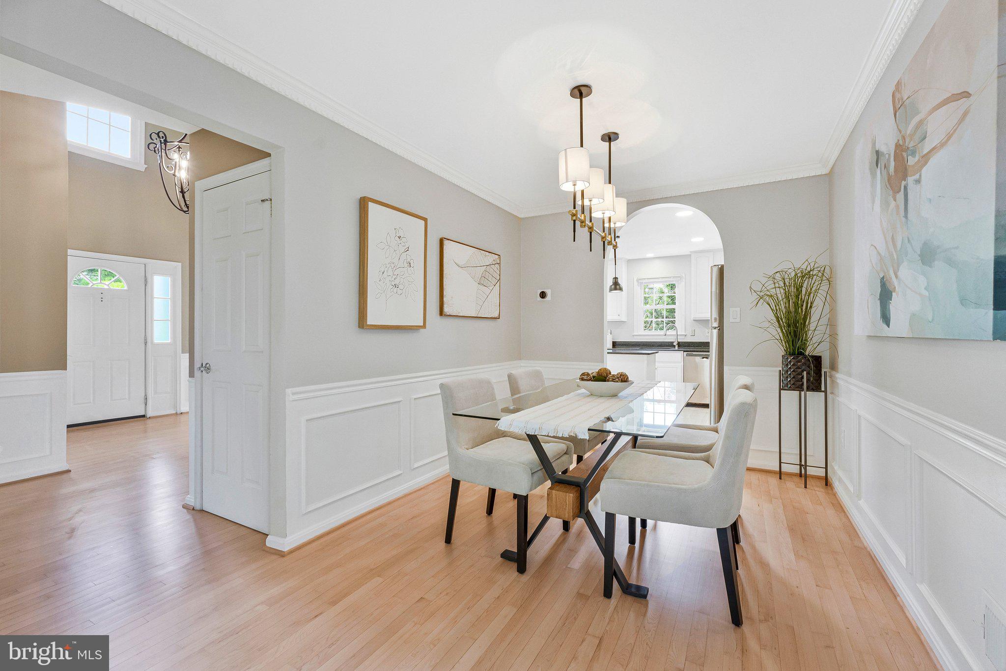 2000 Gallows Tree Lane Vienna, VA 22182 - Photo 11 of 58 a view of a dining room with furniture wooden floor and chandelier