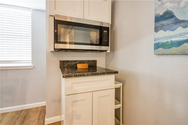 a kitchen with a stove and a microwave