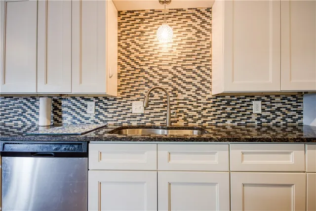 a view of a kitchen counter space and a window