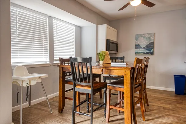 a view of a dining room with furniture and chandelier