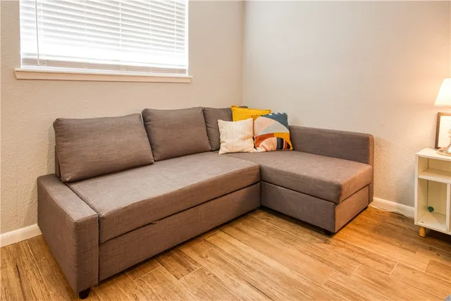 a living room with furniture and a window