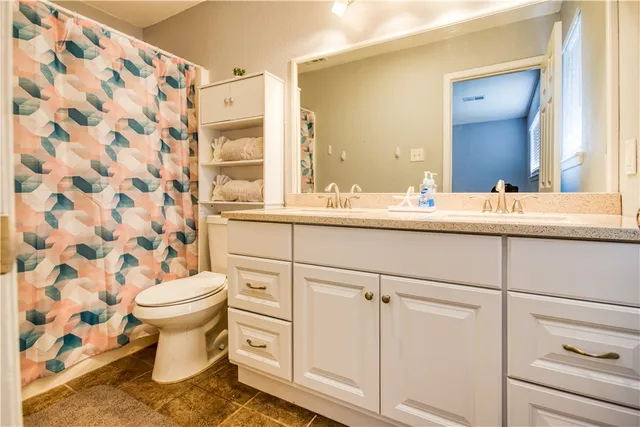 a bathroom with a sink and a toilet