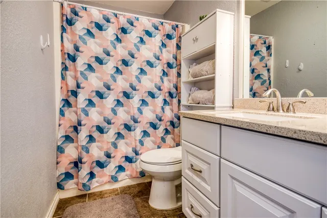 a bathroom with a sink and a toilet
