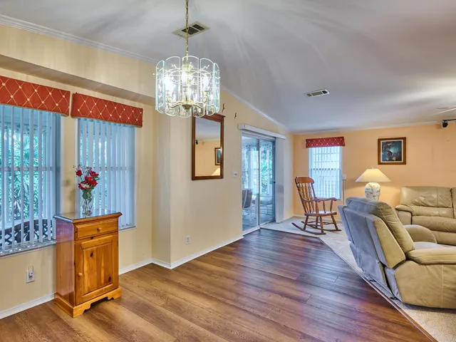 a living room with furniture and a lamp