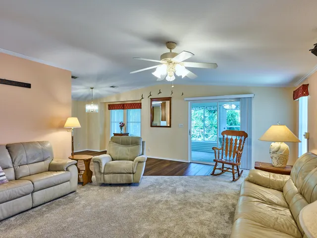 a bed room with a bed and a chandelier