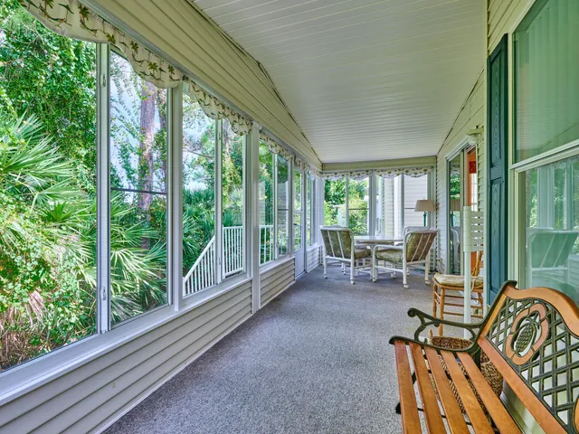 a bedroom with a large bed and chandelier