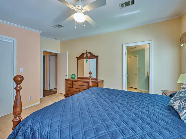 a bathroom with a toilet and a mirror