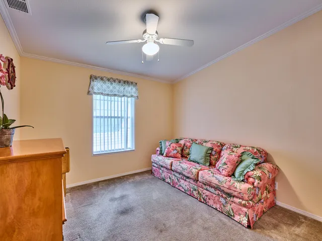 a view of a swimming pool with a table and chairs