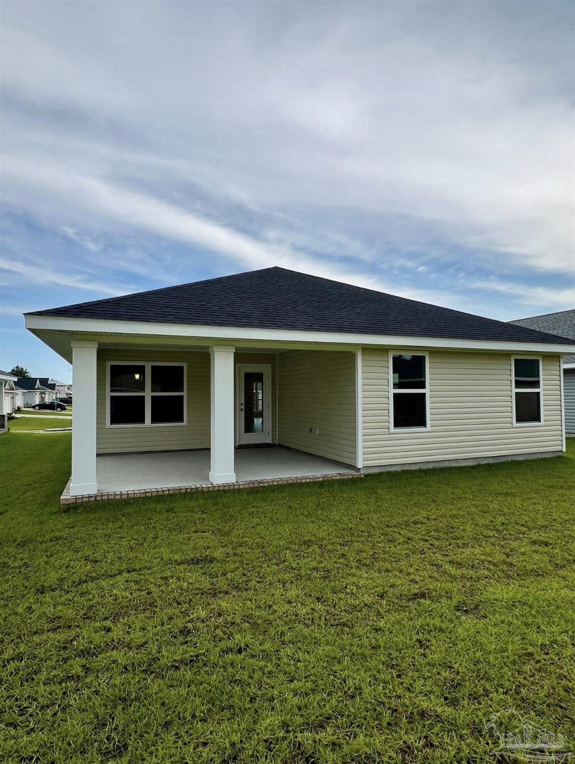 1766 Leigh Loop, Unit 3D Cantonment, FL 32533 - Photo 7 of 8 a view of a house with a backyard