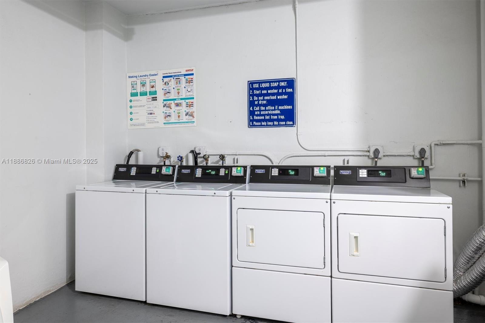 200 Diplomat Parkway, Unit 825 Hallandale Beach, FL 33009 - Photo 24 of 29 a kitchen with cabinets a window and a stainless steel appliances