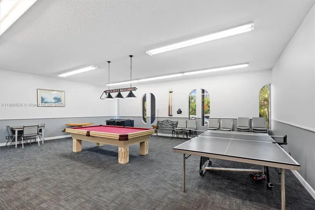 a living room with furniture a table and chairs