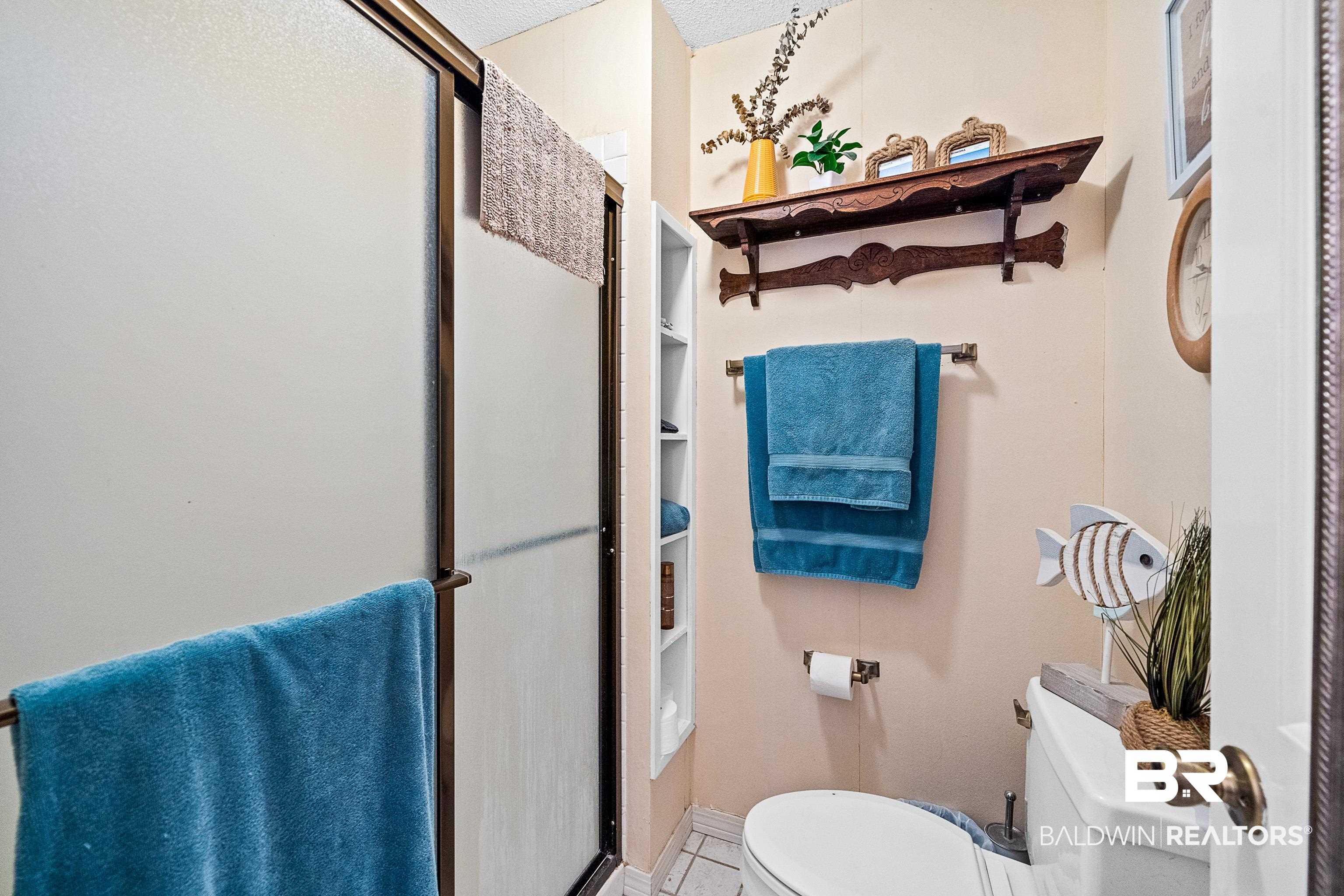 1701 Regency Road, Unit 106 Gulf Shores, AL 36542 - Photo 11 of 42 Full bath with a stall shower and toilet