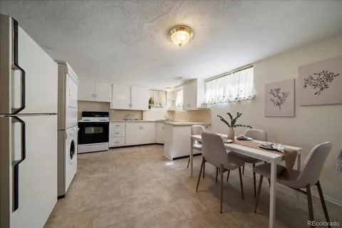 a view of kitchen with cabinets and wooden floor