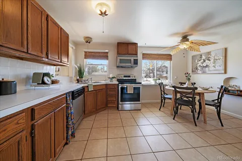 a kitchen with stainless steel appliances granite countertop a sink and cabinets