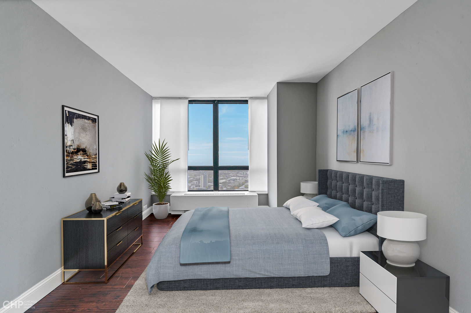 5415 North Sheridan Road, Unit 5409 Chicago, IL 60640 - Photo 15 of 37 a bedroom with a bed and a couch