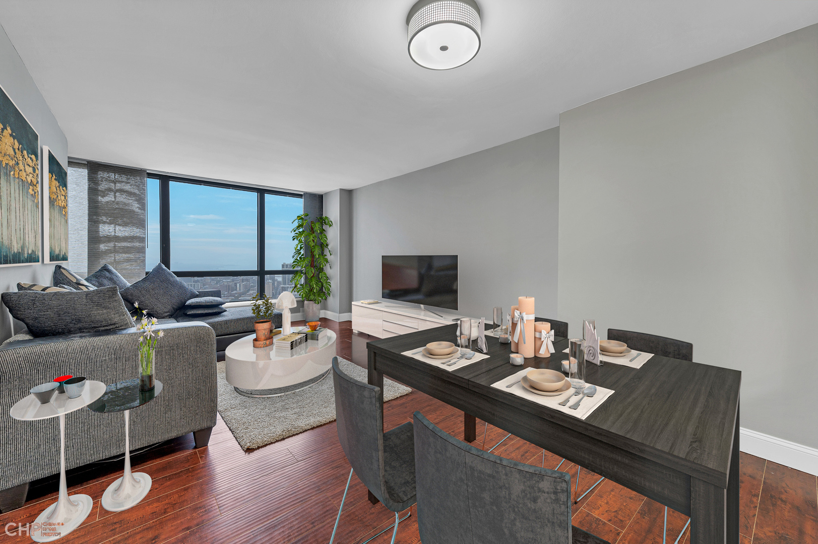 5415 North Sheridan Road, Unit 5409 Chicago, IL 60640 - Photo 7 of 37 a living room with furniture and a flat screen tv