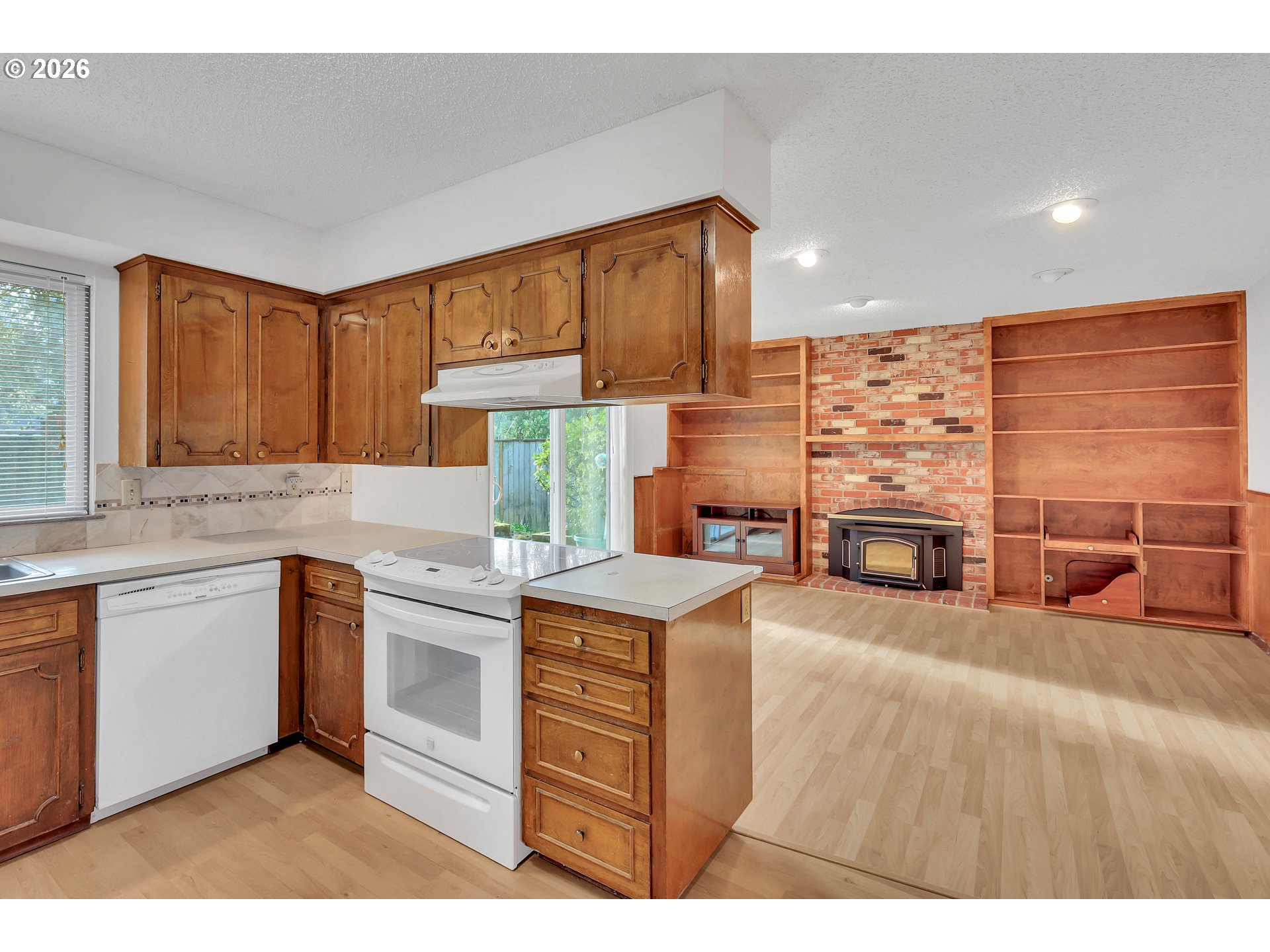 6980 Southwest 130th Avenue Beaverton, OR 97008 - Photo 15 of 38 a kitchen with stainless steel appliances granite countertop a stove a sink and a microwave