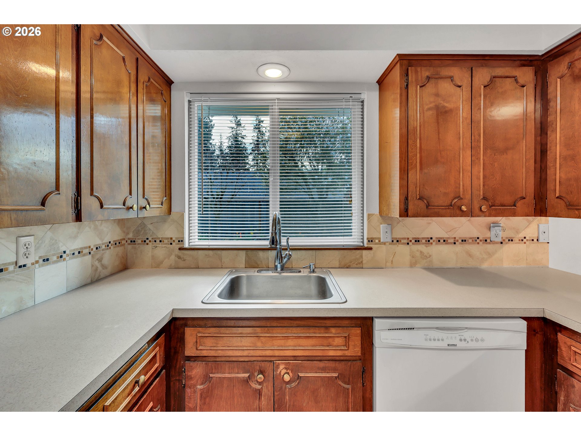 6980 Southwest 130th Avenue Beaverton, OR 97008 - Photo 19 of 38 a kitchen with a sink and a window
