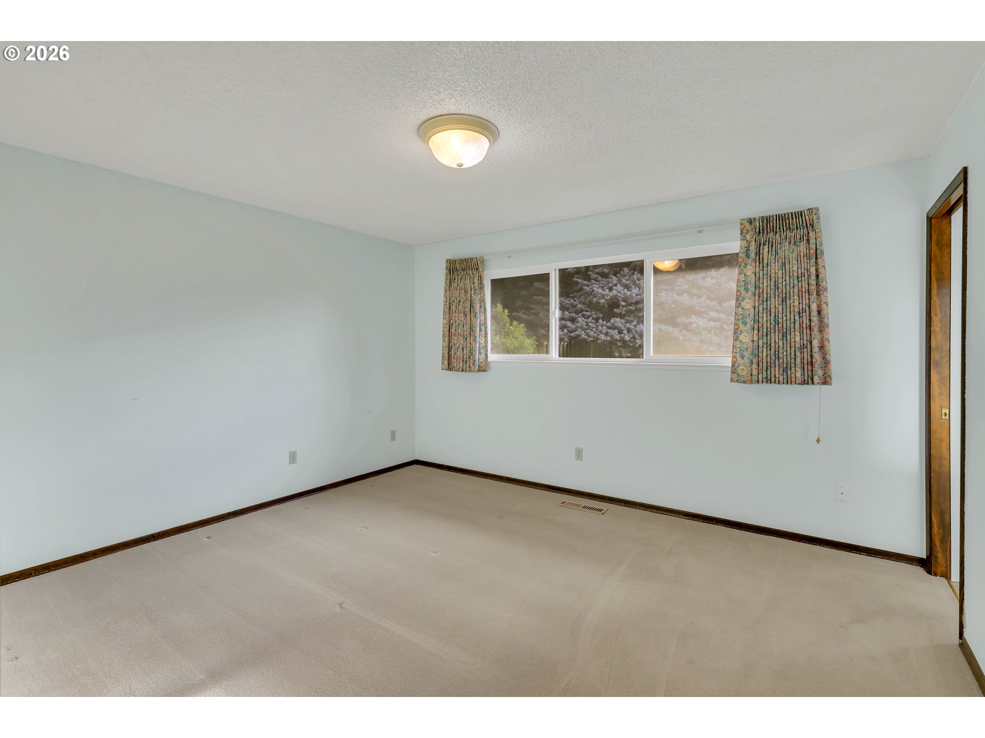 6980 Southwest 130th Avenue Beaverton, OR 97008 - Photo 20 of 38 a view of an empty room with a window