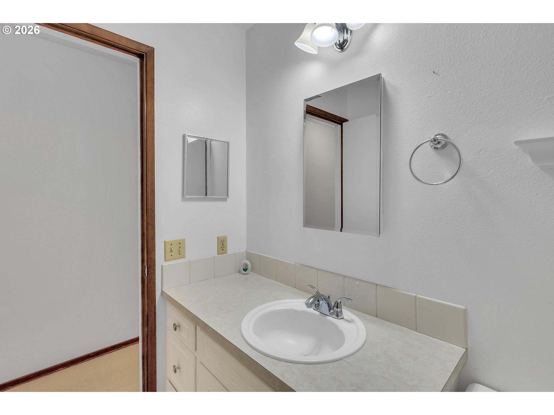 6980 Southwest 130th Avenue Beaverton, OR 97008 - Photo 29 of 38 a bathroom with a sink and a mirror