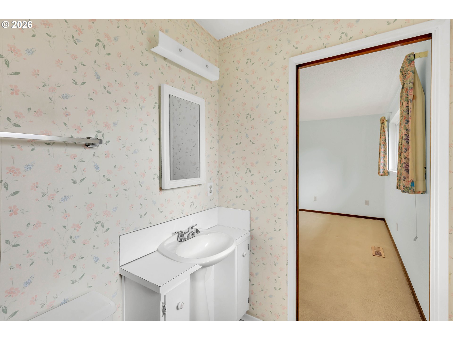 6980 Southwest 130th Avenue Beaverton, OR 97008 - Photo 32 of 38 a bathroom with a sink and a mirror