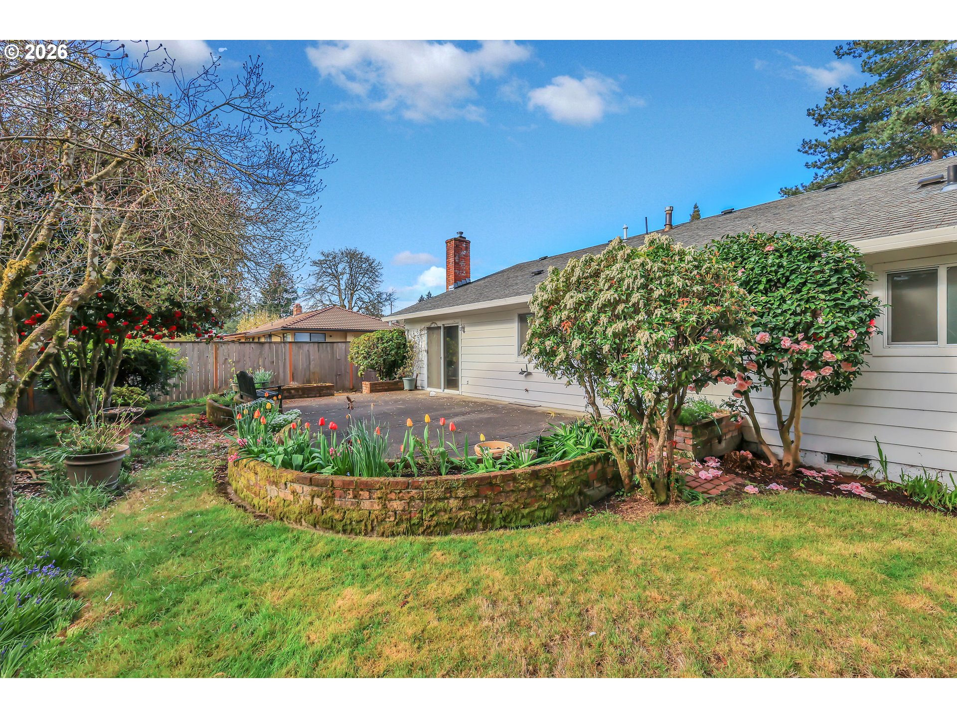 6980 Southwest 130th Avenue Beaverton, OR 97008 - Photo 38 of 38 a front view of a house with a garden