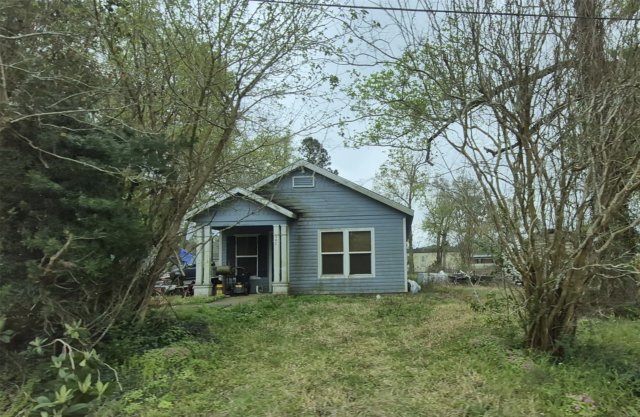 542 Horn Road Lumberton, TX 77657 - Photo 3 of 3 a view of a house with a yard and large tree