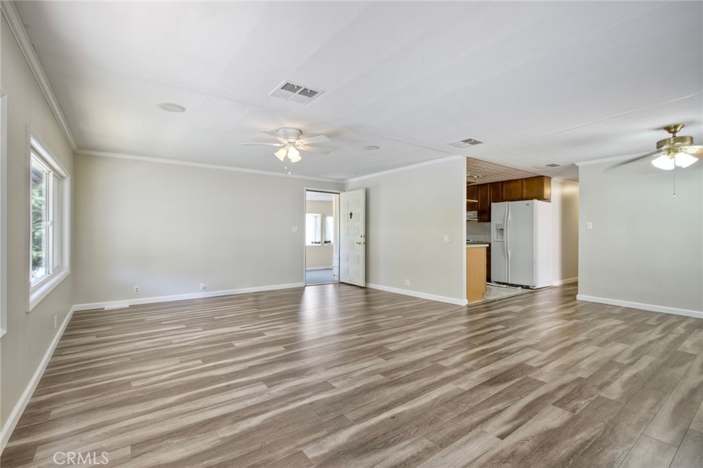 4747 Oak Crest Road, Unit 28 Fallbrook, CA 92028 - Photo 13 of 29 wooden floor in an empty room with a window