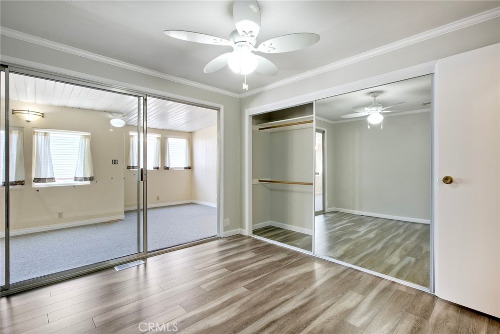 4747 Oak Crest Road, Unit 28 Fallbrook, CA 92028 - Photo 21 of 29 a view of empty room with wooden floor and fan