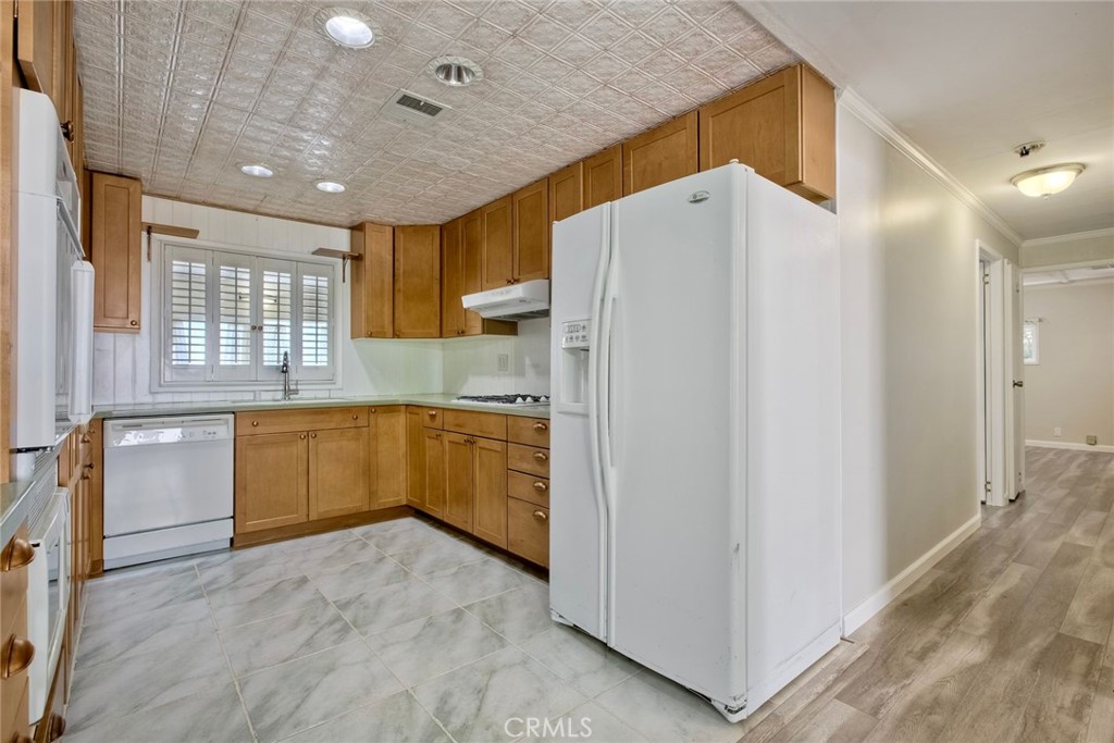 4747 Oak Crest Road, Unit 28 Fallbrook, CA 92028 - Photo 8 of 29 a kitchen with a refrigerator and a sink