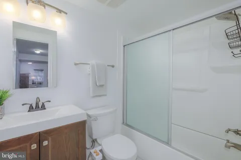 a bathroom with a sink toilet and vanity