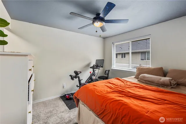 a bedroom with a bed and window