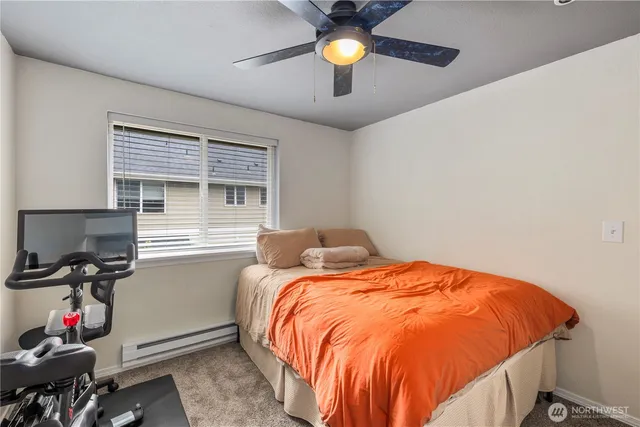 a bedroom with bed and a window