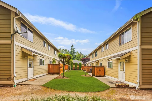 a front view of a house with a yard