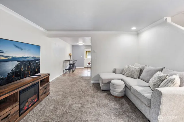 a living room with furniture and a lamp