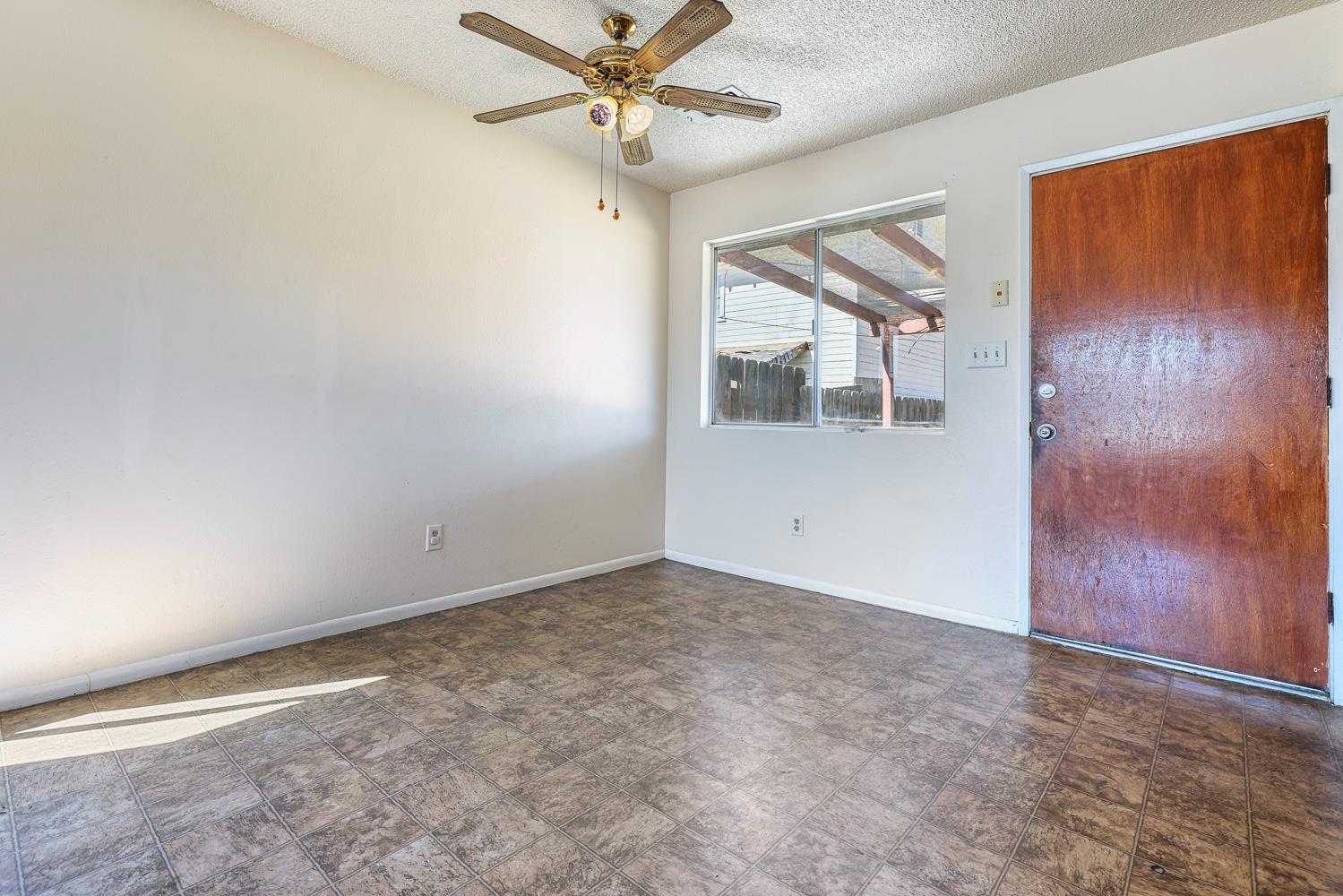180 Monroe Street Coalinga, CA 93210 - Photo 22 of 25 a view of an empty room with a window