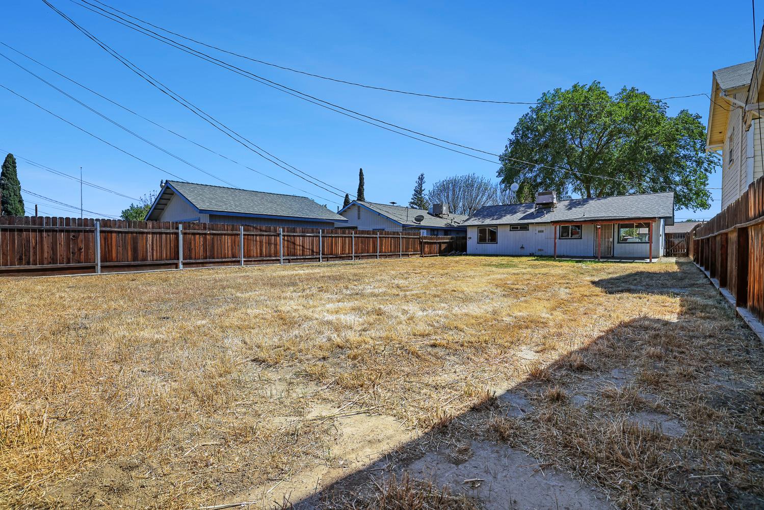 180 Monroe Street Coalinga, CA 93210 - Photo 23 of 25 a view of a house with a yard