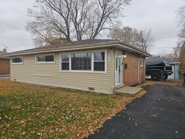 a house with trees in the background