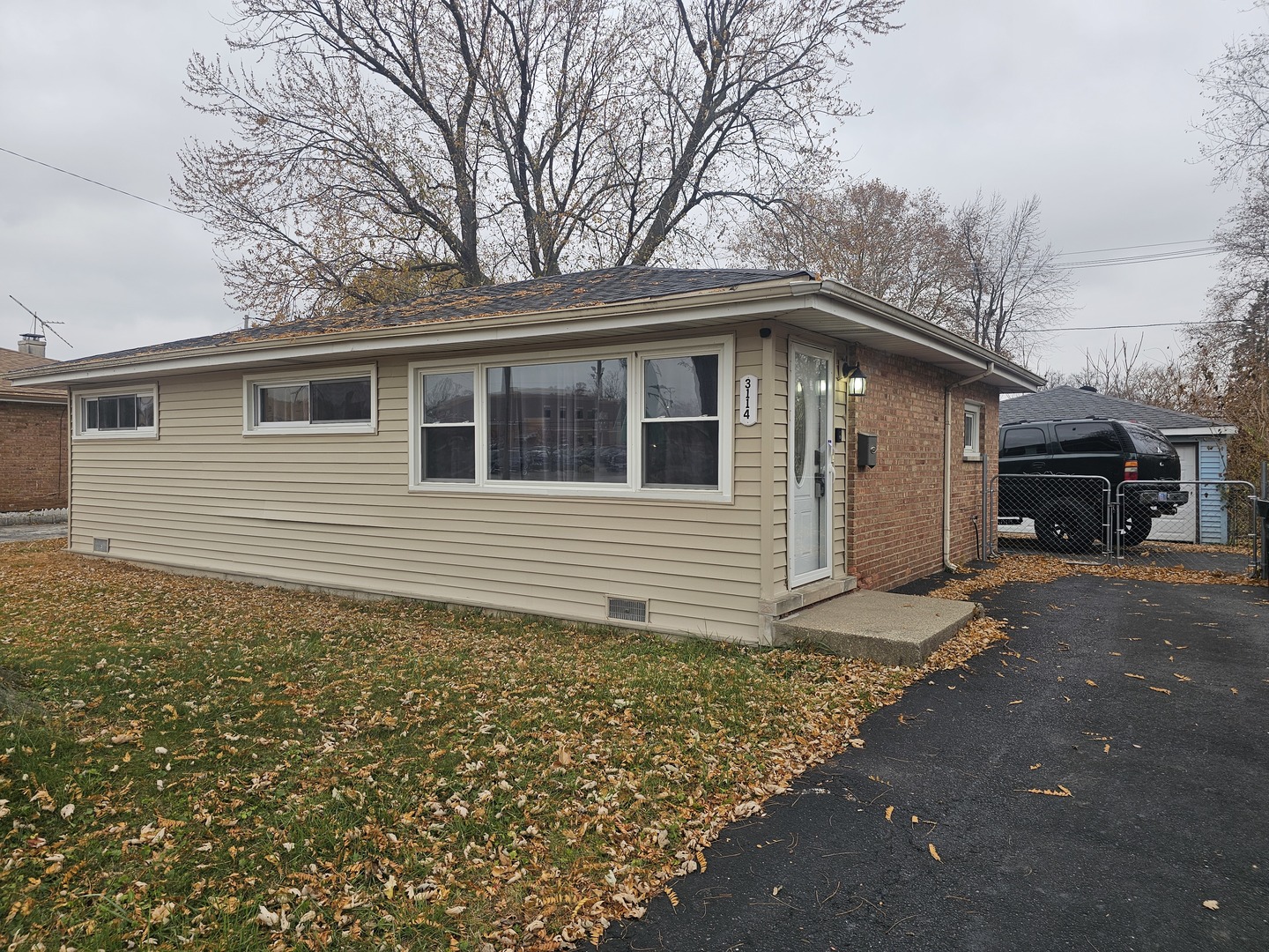 a house with trees in the background